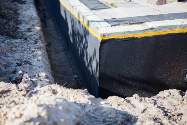 Professional Waterproofing technician working in Logan, OH